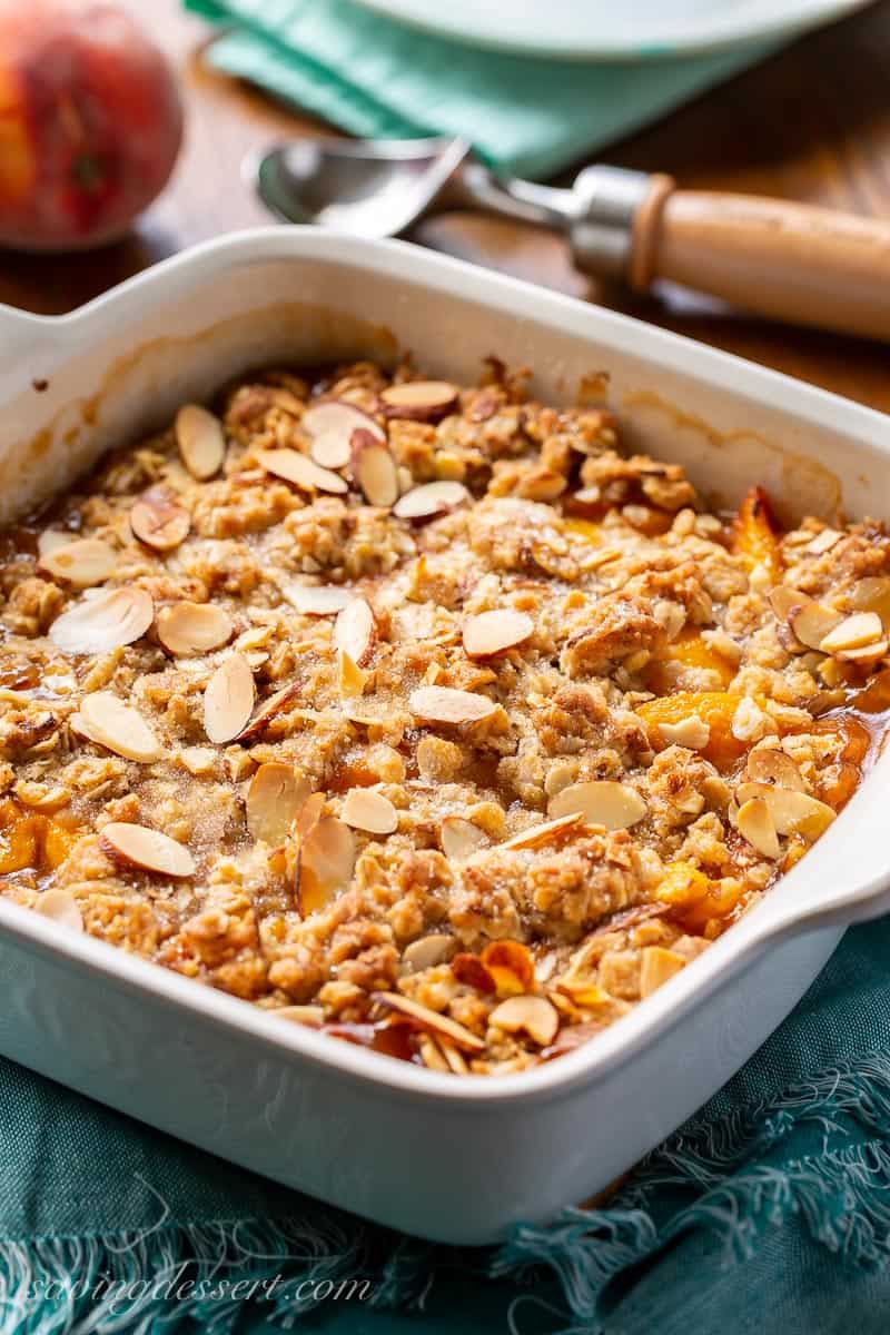 Side view of a Peach Crisp in a square baker