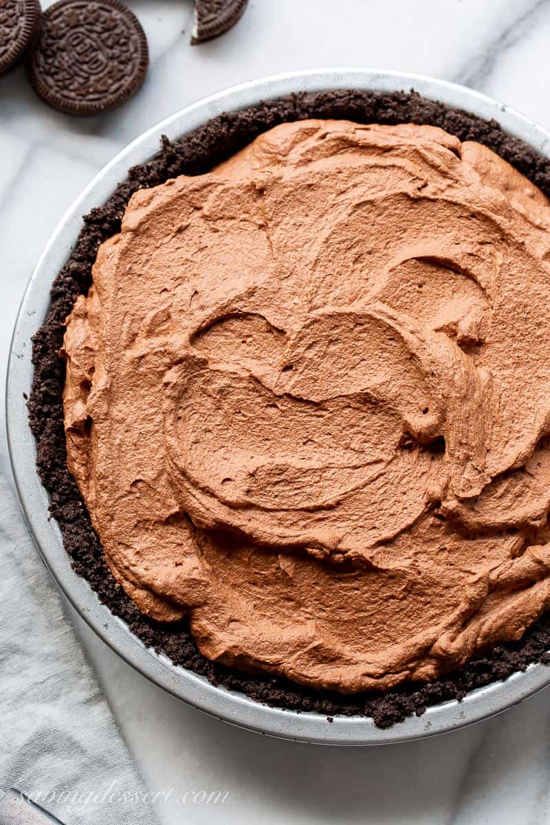 Chocolate Oreo cookie pie crust filled with a mousse-like chocolate filling