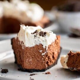 A slice of chocolate icebox pie cut with a fork