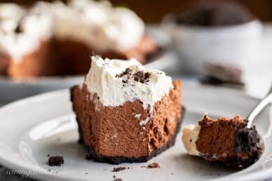 A slice of chocolate icebox pie cut with a fork