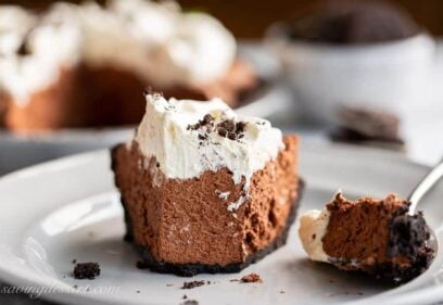 A slice of chocolate icebox pie cut with a fork