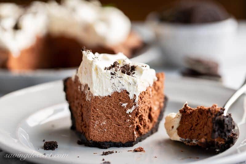 A slice of chocolate icebox pie cut with a fork