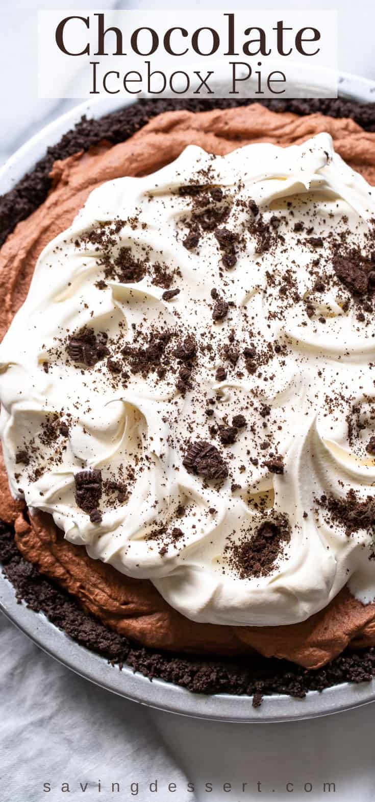 Chocolate Icebox Pie with whipped cream and cookies on top