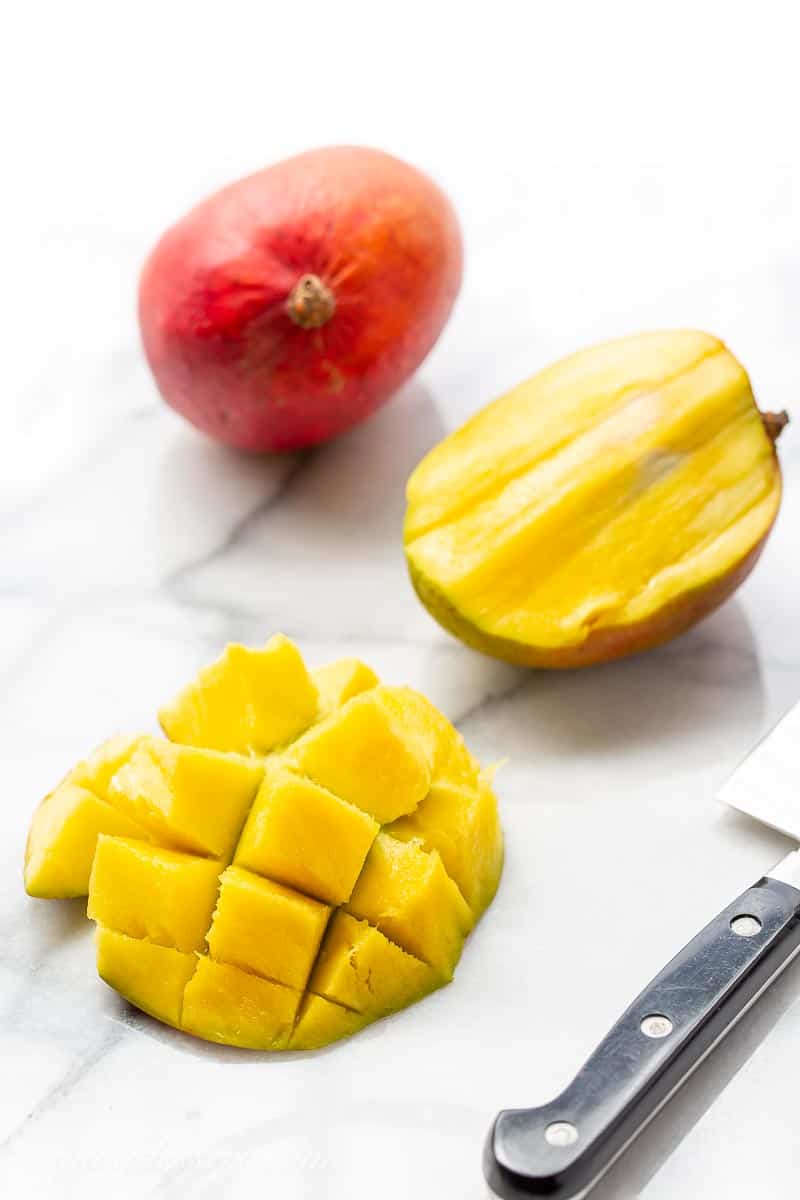 A sliced mango on marble