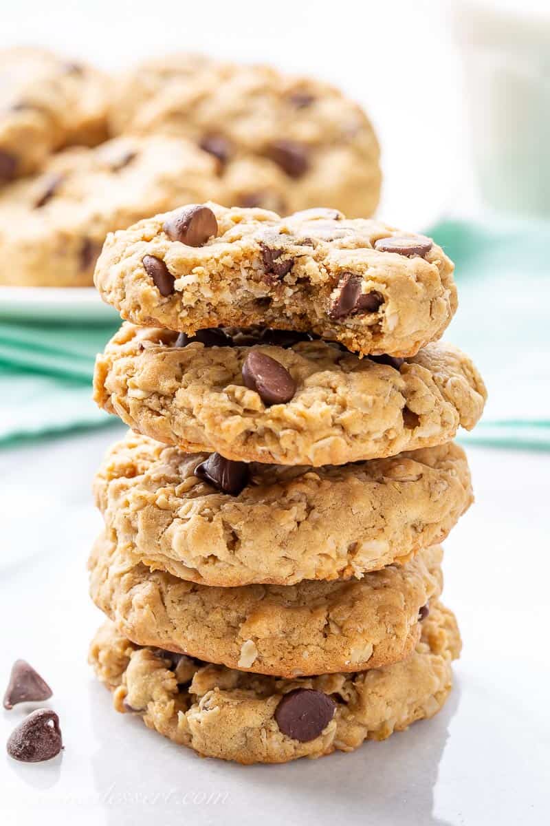 A stack of thick and chewy cookies with chocolate chips