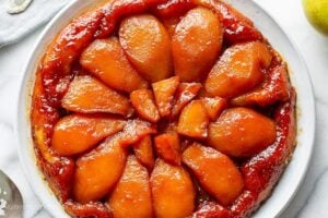 Overhead view of a pear tart over a pastry crust