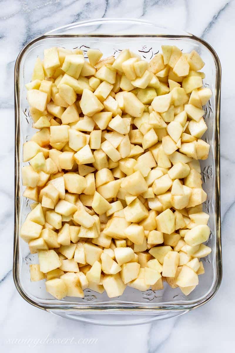 A pan filled with diced apples