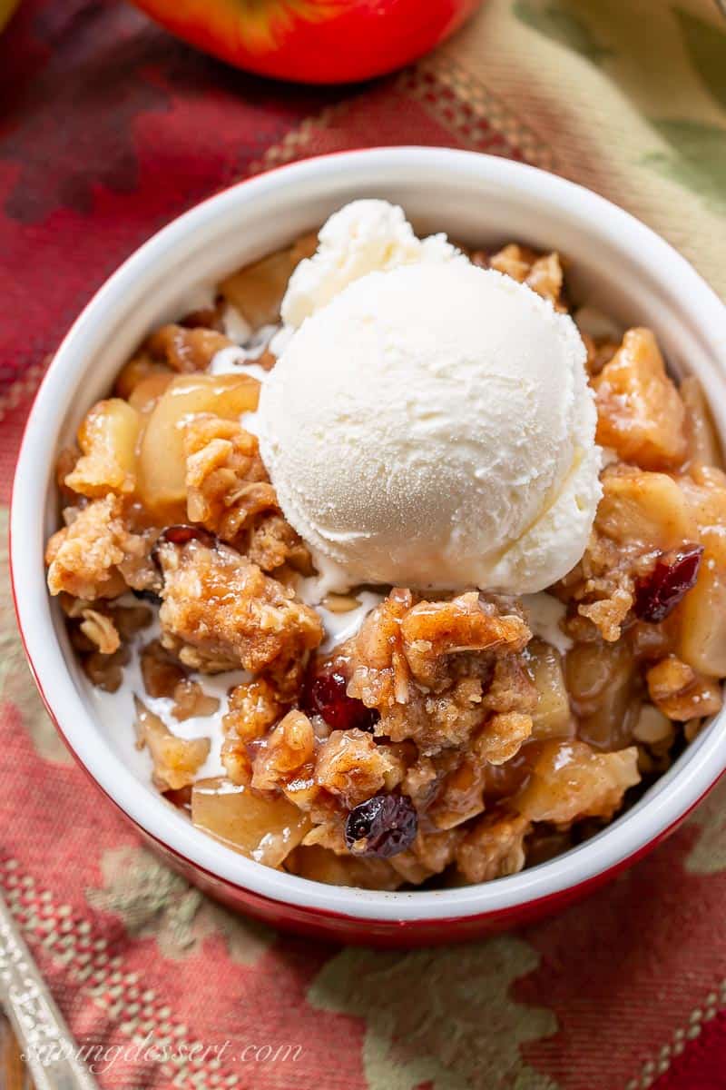 Closeup of a bowl of apple crisp with ice cream