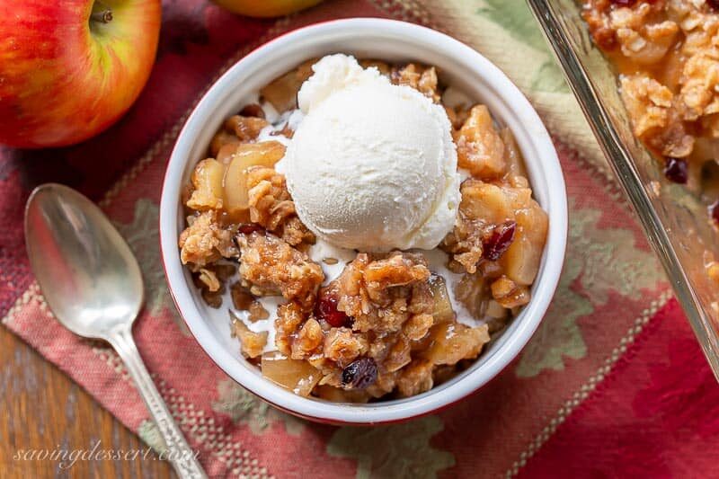 Overhead view of a ramekin filled with apple crisp and ice cream