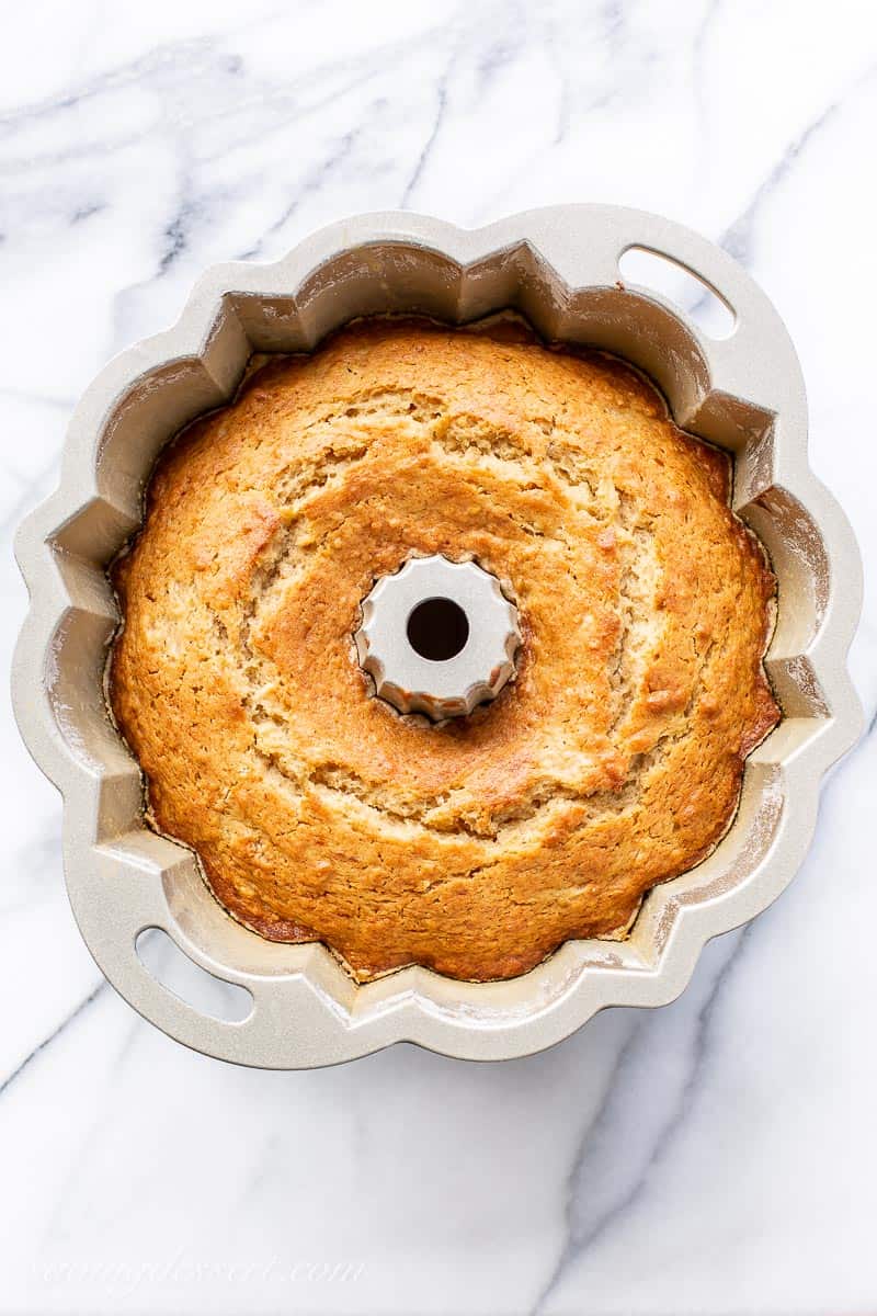 An overhead view of a baked Bundt cake in the pan