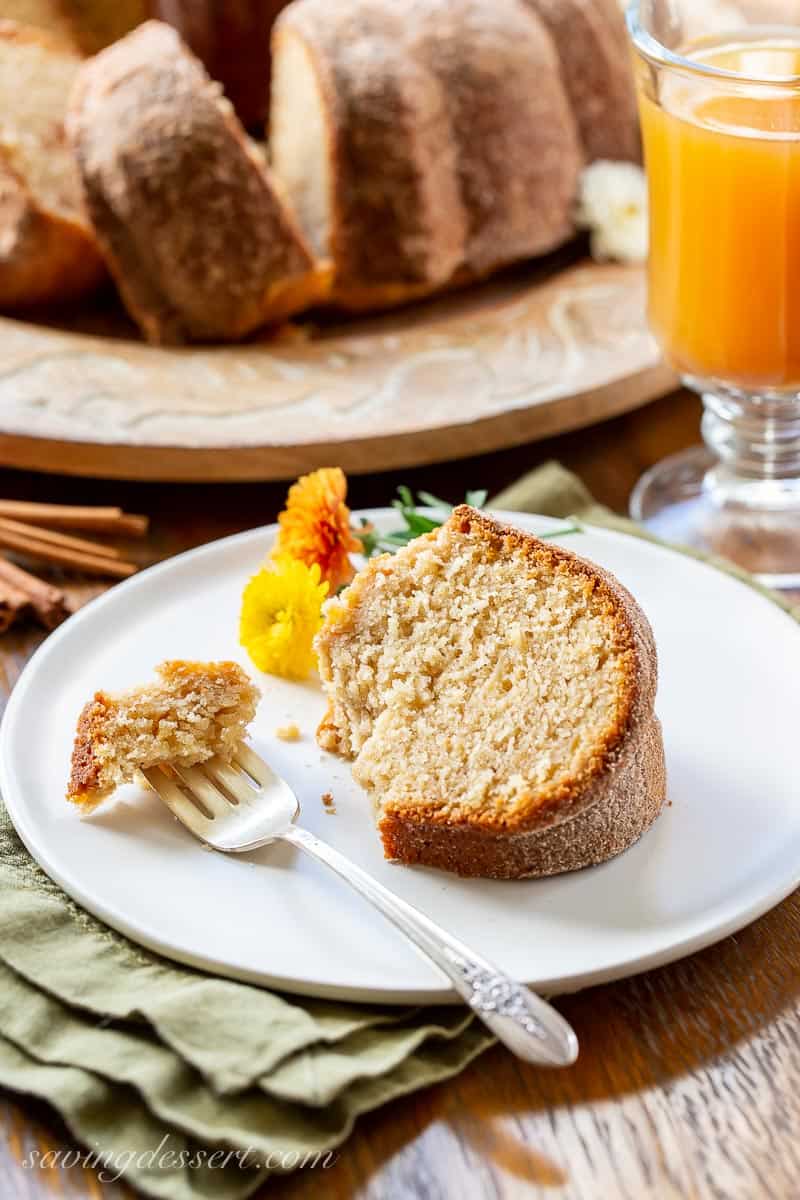 A slice of apple cider donut cake on a plate