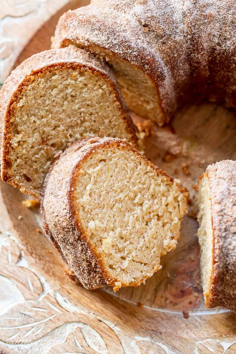 Closeup of a few slices of apple cider donut cake on a platter