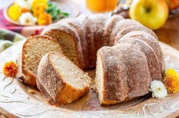 Apple Cider Donut Cake on a wood platter