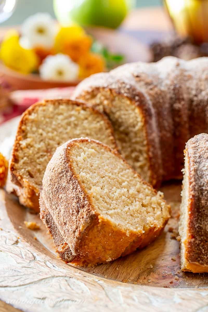 Sliced Bundt cake on a wooden platter