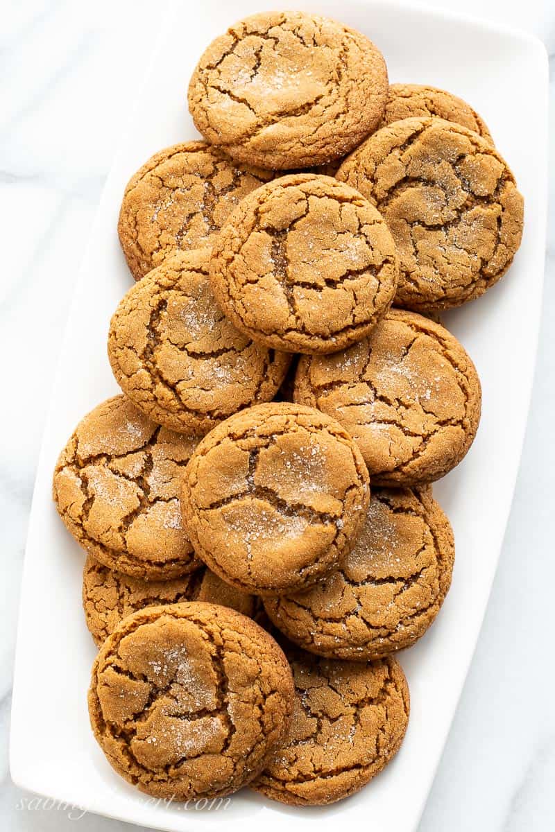 Overhead view of a platter of dark brown cracked molasses cookies