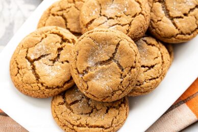Closeup of a platter of crinkled molasses cookies