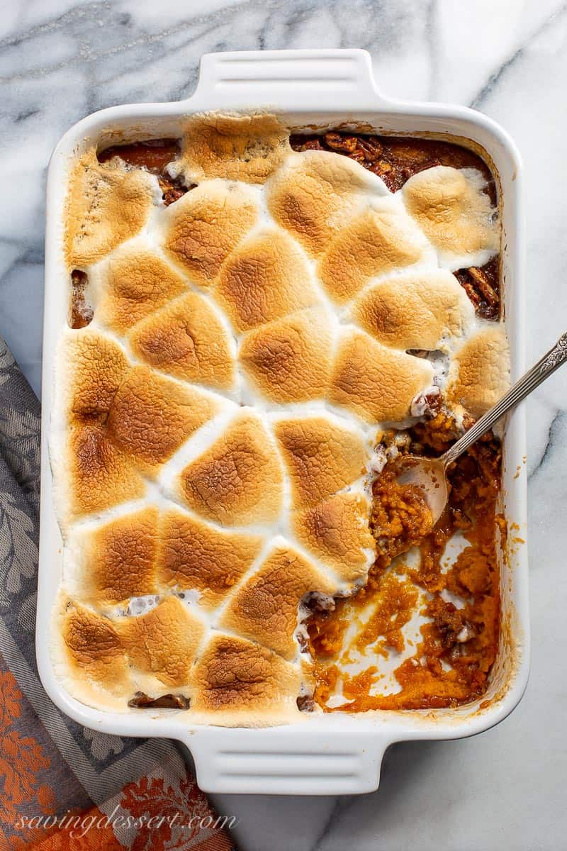 Overhead view of a sweet potato casserole with toasted marshmallows on top