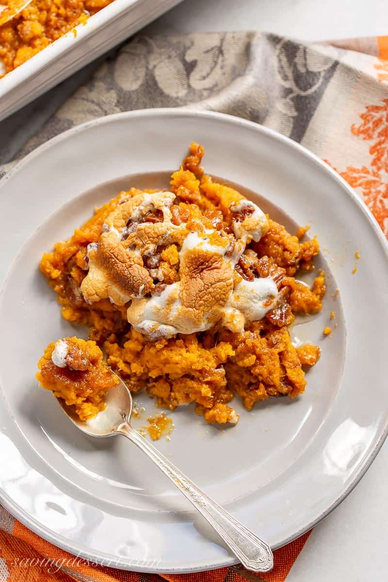 A plate filled with sweet potato casserole