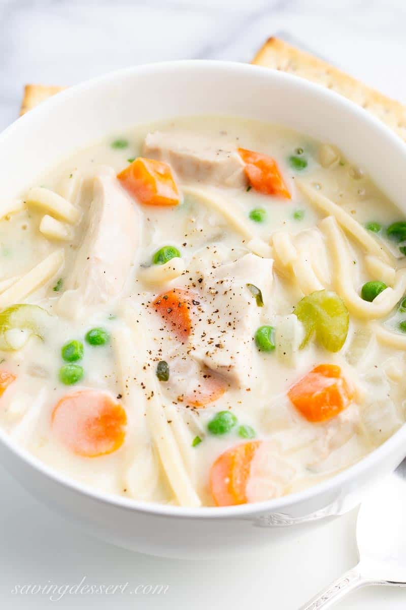 Closeup of a bowl of creamy chicken noodle soup