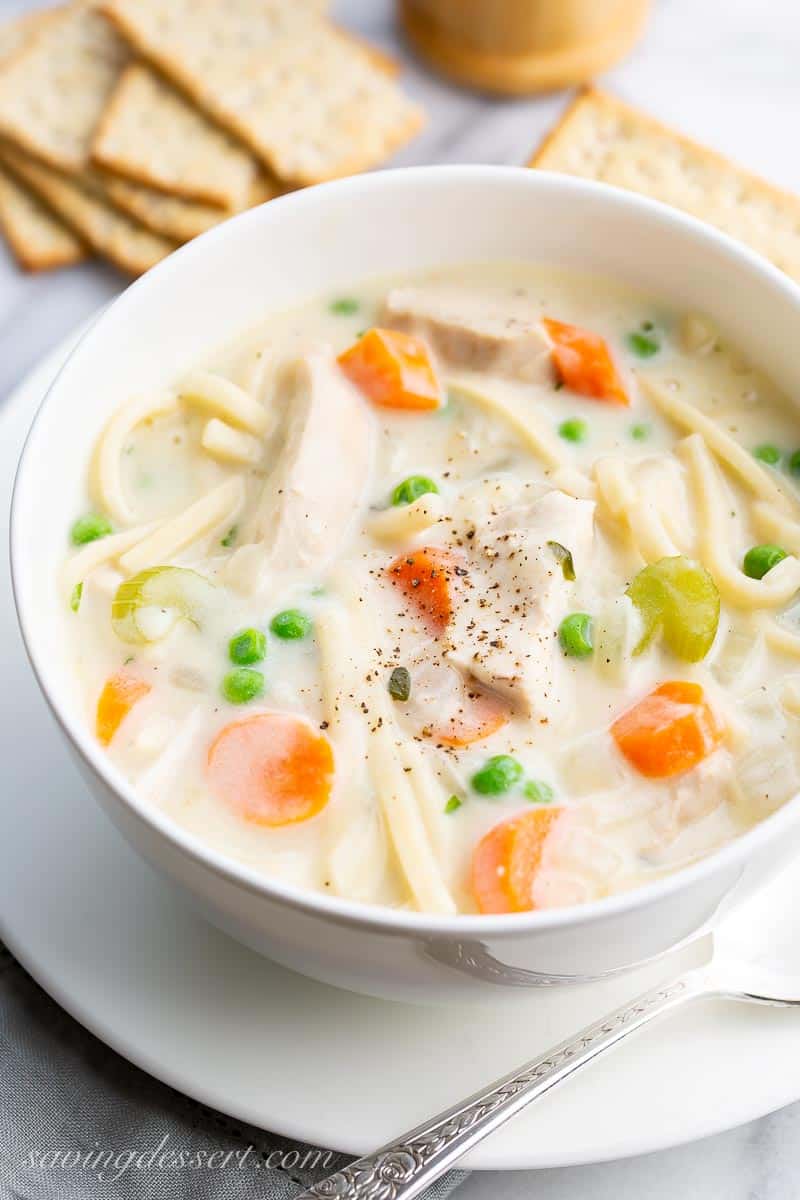 Crackers and soup in a white bowl
