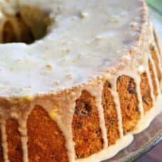 Cranberry Orange Coffee Cake with an orange glaze spooned over the top