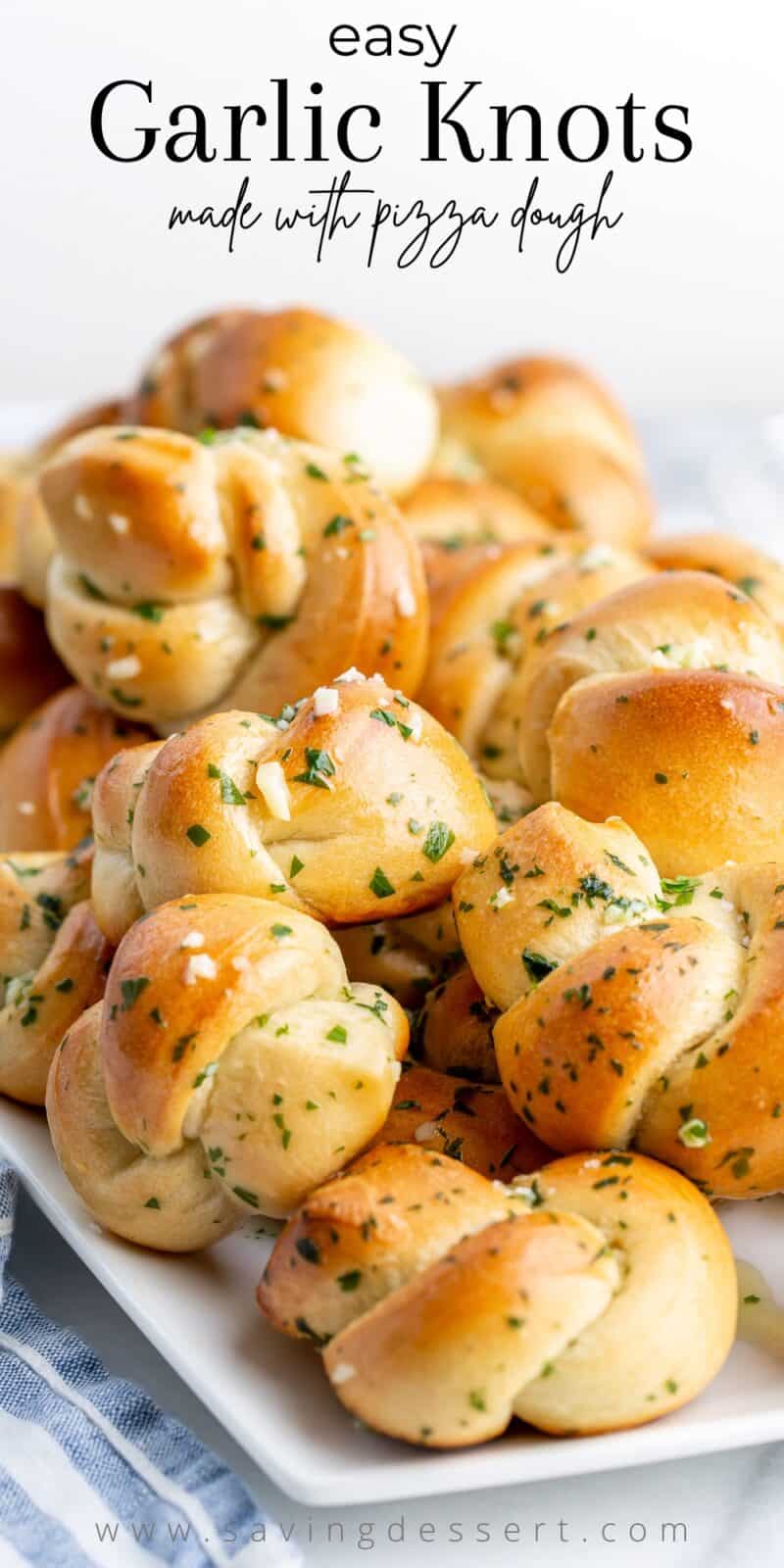 A platter of buttery Garlic Knots topped with Parmesan and parsley
