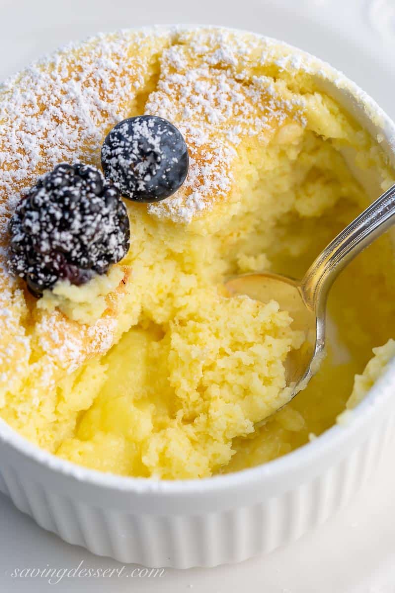 An inside look at a ramekin filled with lemon pudding cake