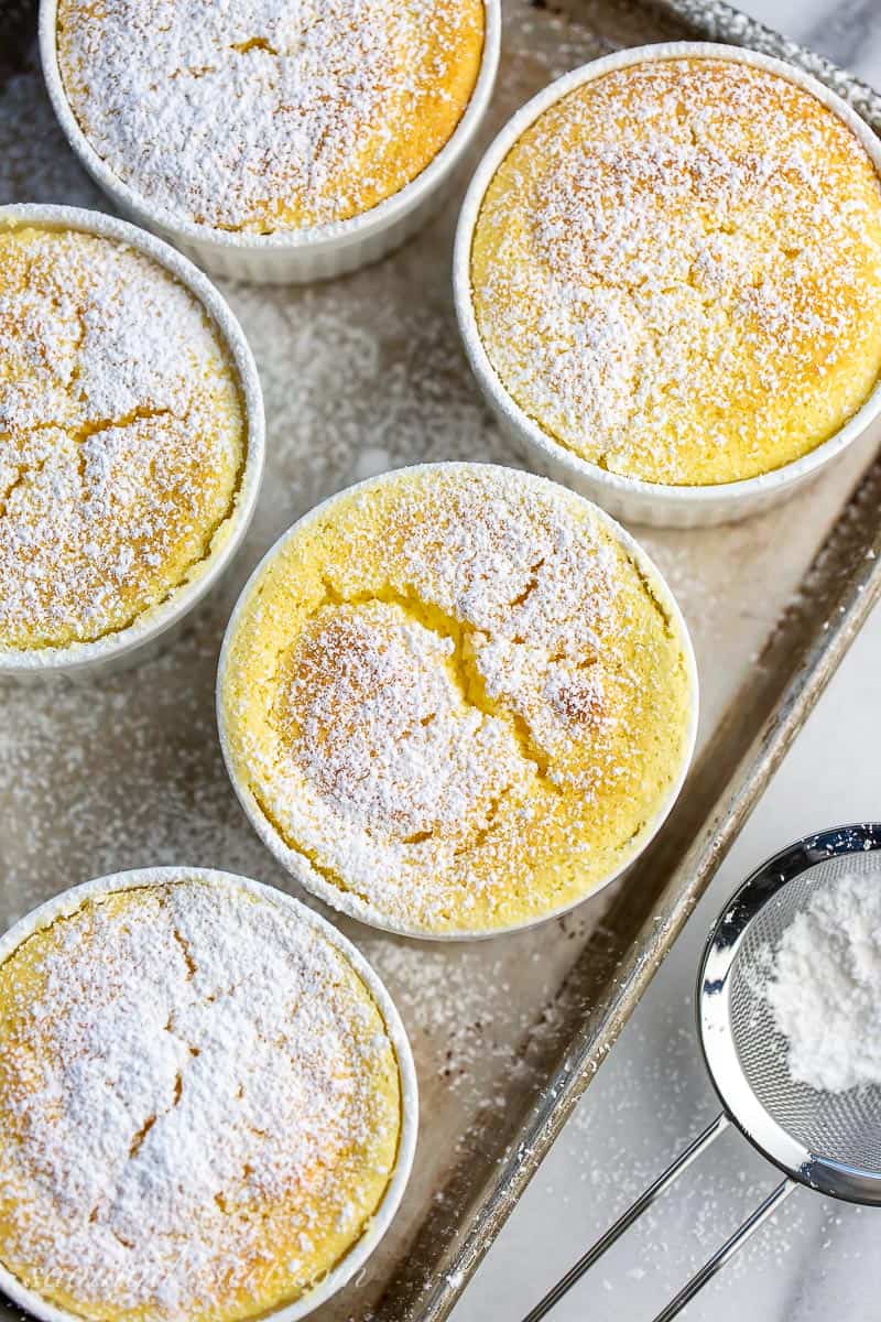 Overhead view of baked lemon cakes on a tray