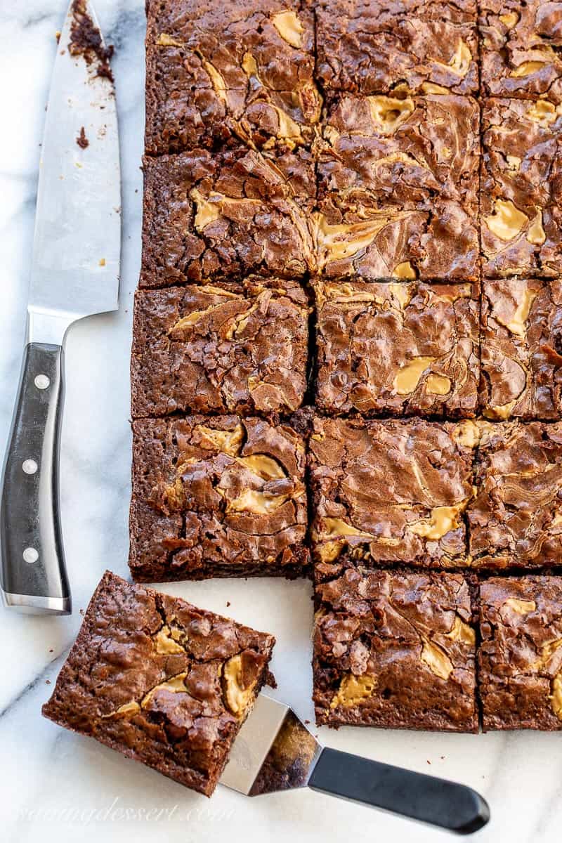 Overhead view of a pan of brownies with a peanut butter swirl