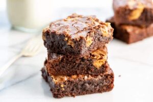 Brownies with a jug of milk and a fork
