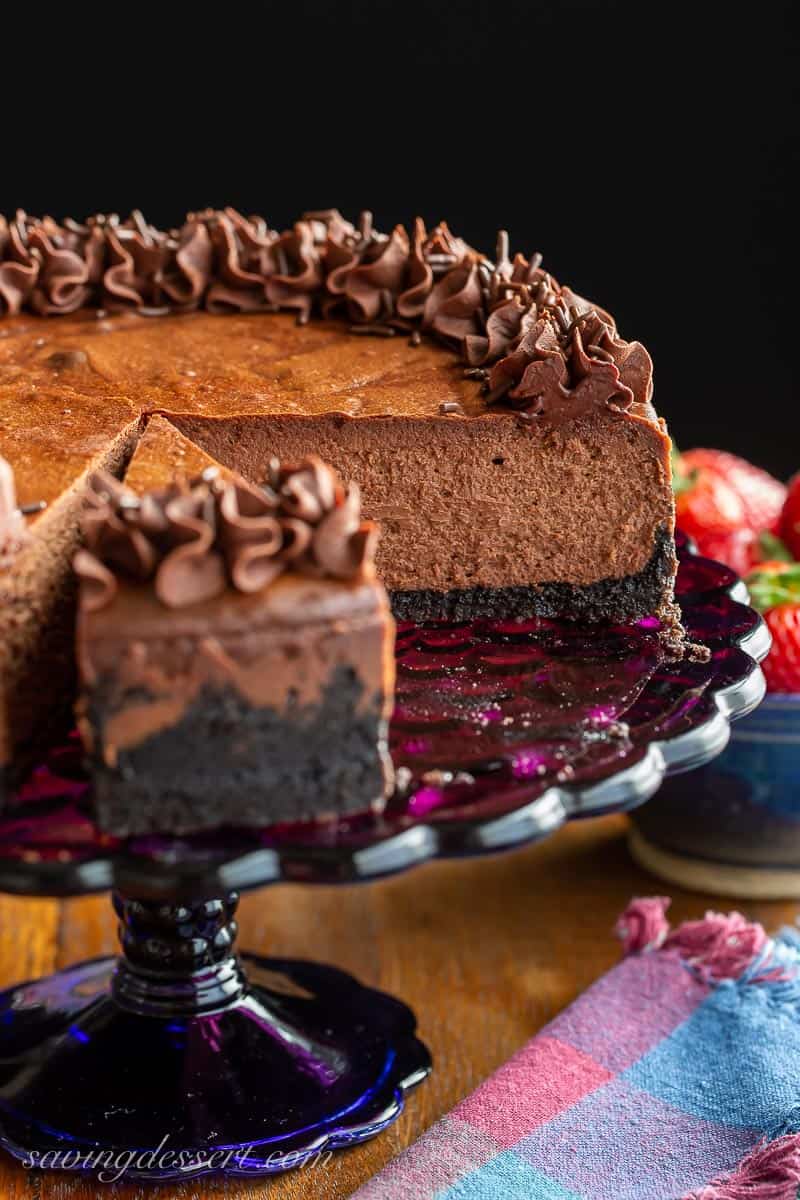 A sliced chocolate cheesecake from the side showing the interior