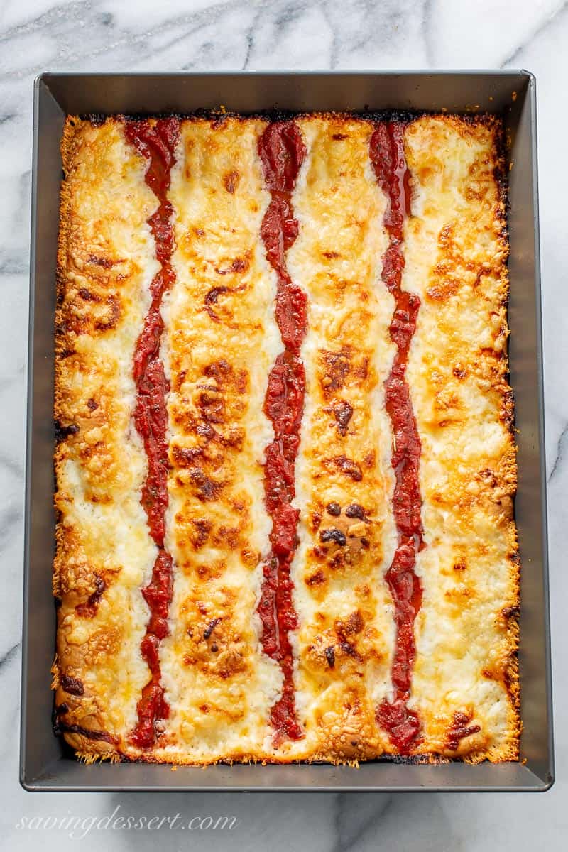 A baked Detroit-Style Pizza in a pan
