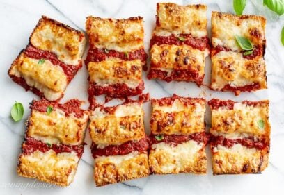 Overhead view of a sliced thick crust Detroit-Style Pizza