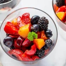 Closeup of a bowl of fruit with mint
