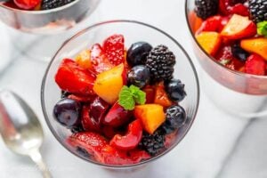 Closeup of a bowl of fruit with mint