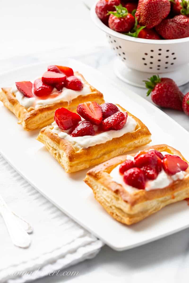 A platter of puff pastry strawberry tarts