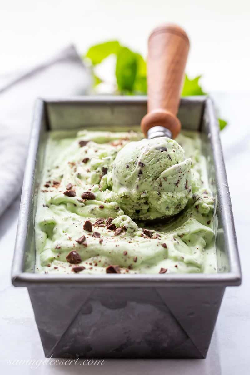 Closeup of a scoop of ice cream with chocolate chips in a loaf pan