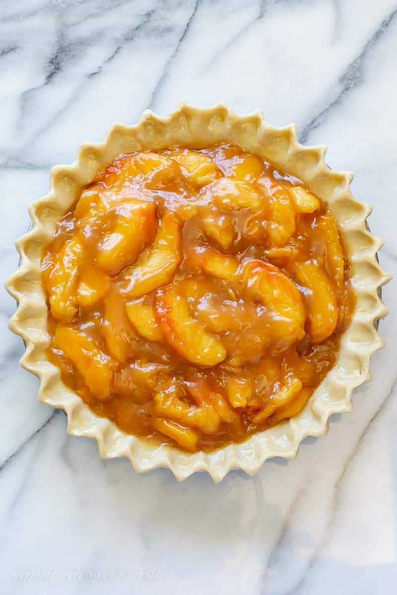 An unbaked peach pie