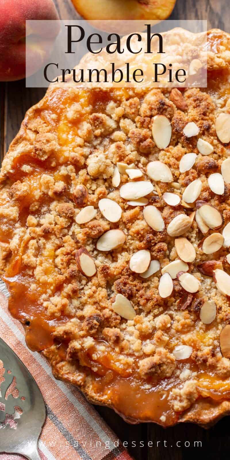 Overhead view of a peach crumble pie with sliced almonds on top