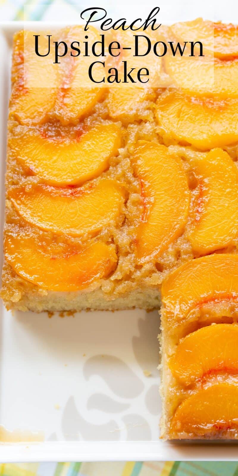 an overhead view of a peach upside down cake with a slice removed