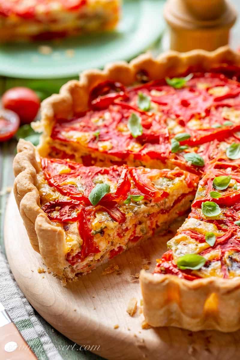 side view of a sliced tomato pie / tart