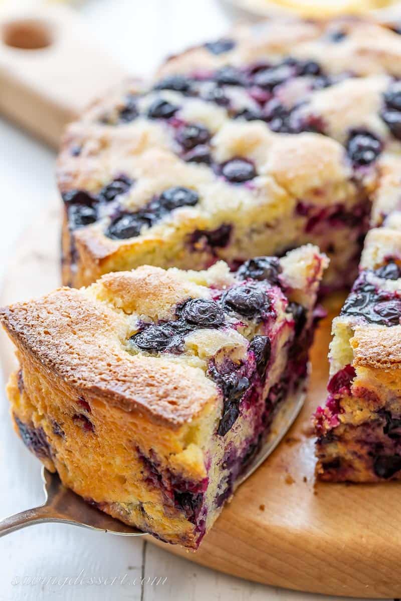 Sliced blueberry cornbread on a cutting board