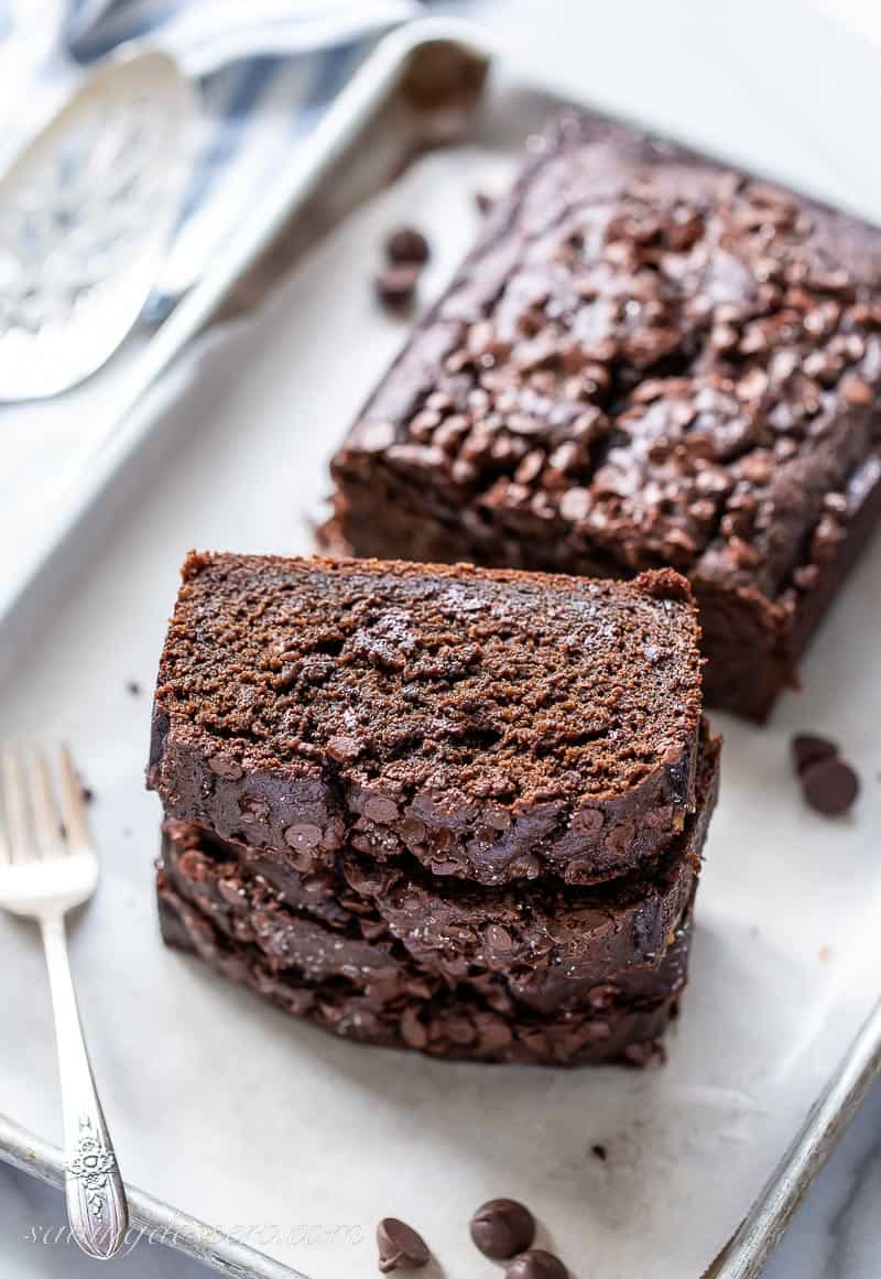 A few slices of chocolate loa cake on a tray