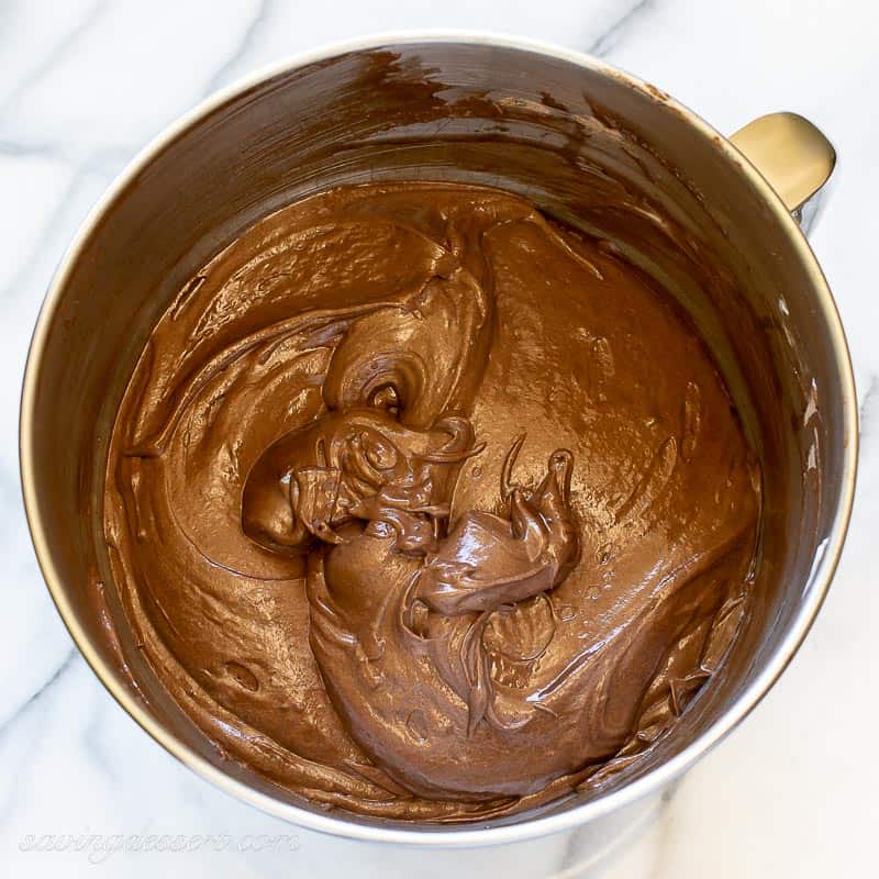 Overhead view of a mixing bowl filled with chocolate cake batter