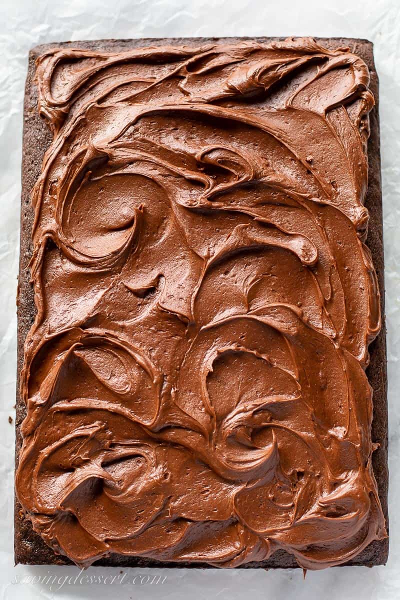 A rectangular cake topped with swirled chocolate frosting