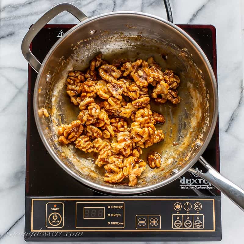 A saucepan with candied walnuts