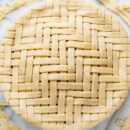 A lattice topped pie not yet baked