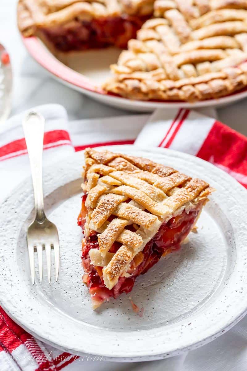 A slice of plum pie on a plate