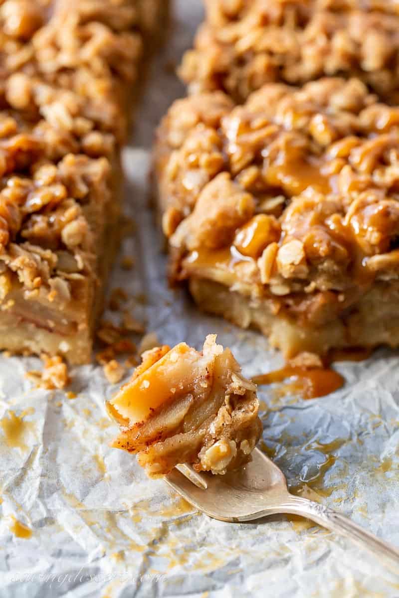 A fork with a piece of apple pie bars