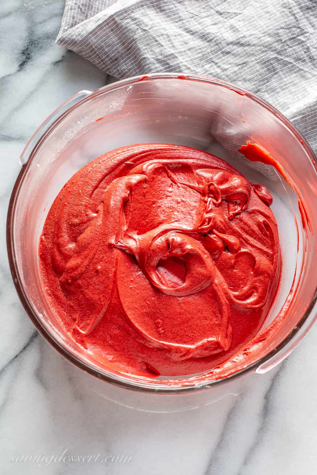 A bowl of red cake batter